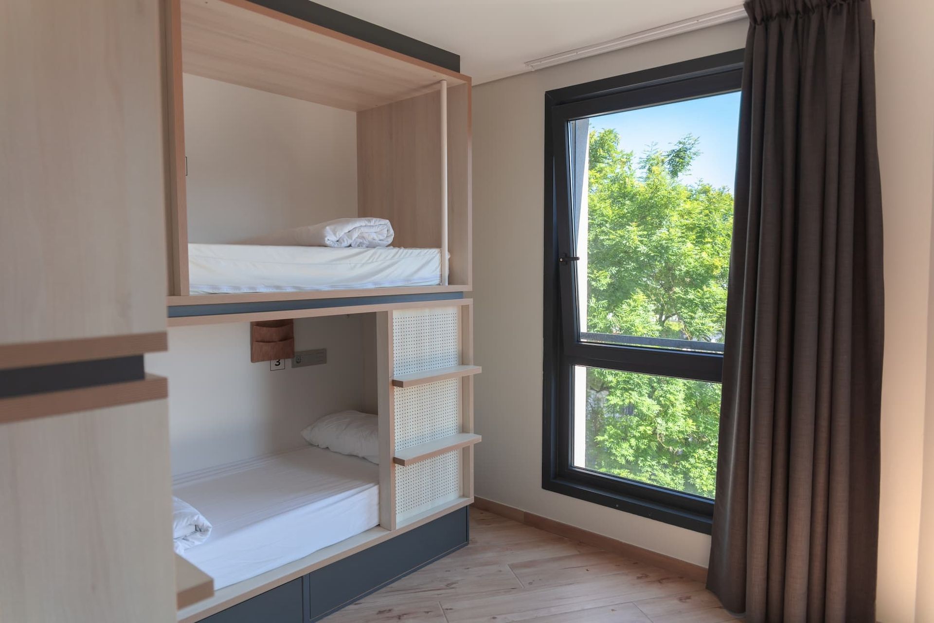 Bed in a shared 6-bed female room with private bathroom